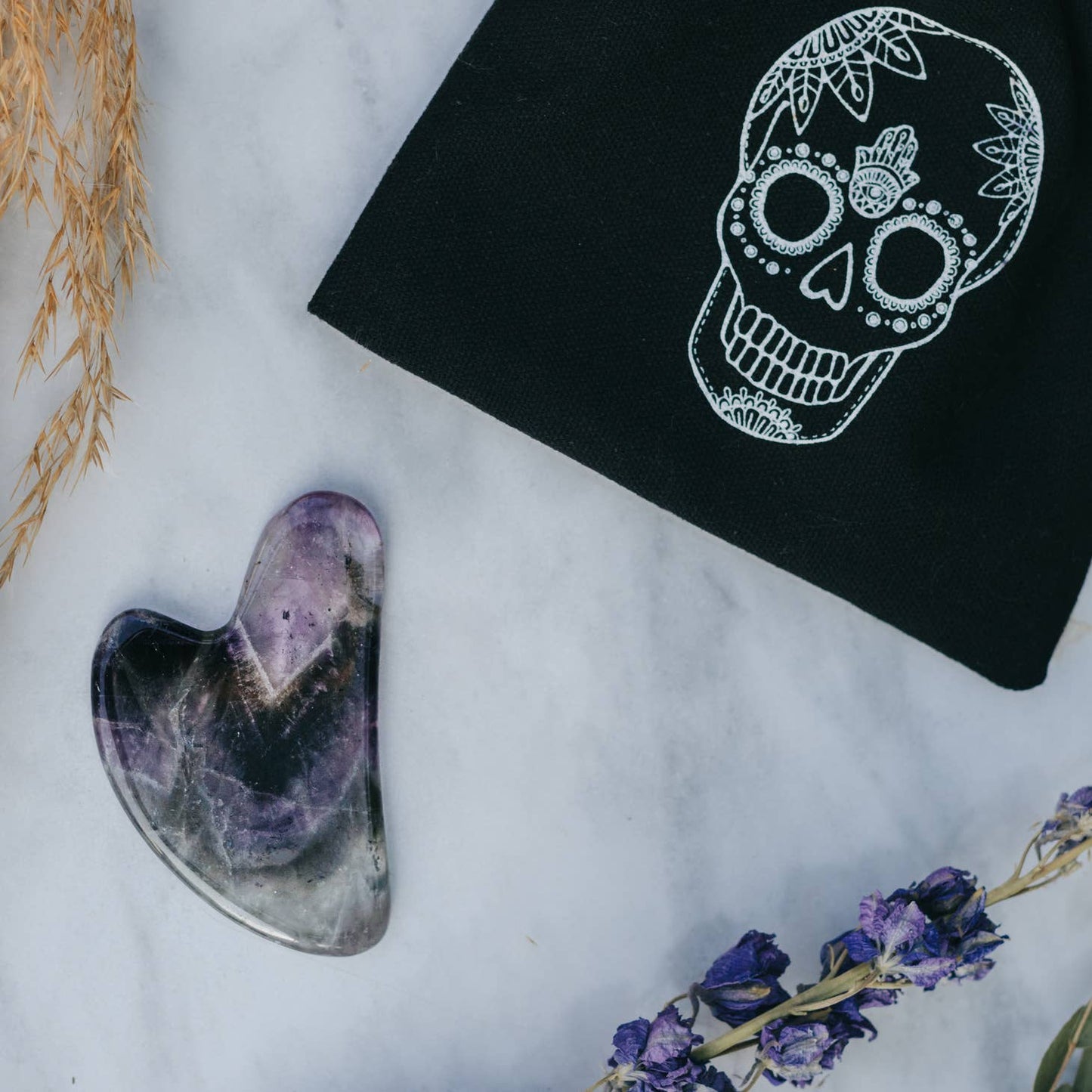 Shadowed Serenity: Amethyst Crystal Gua Sha with Black Skull Pouch